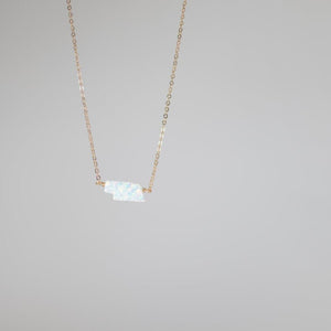 Small Nebraska state pendant in white opal on gold necklace chain