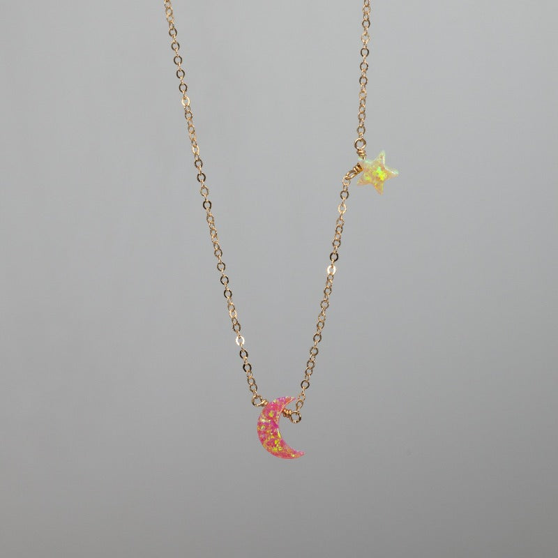 Pink crescent moon charm necklace with yellow star in opal and gold