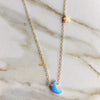 Blue moon charm and yellow star charm on dainty gold chain