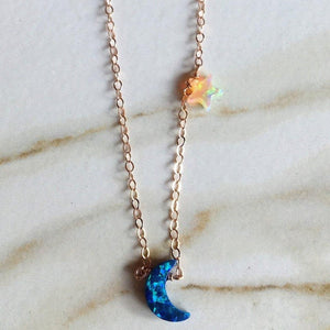 Blue crescent moon and orange star neverland necklace