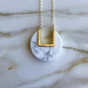 Marbled white howlite circular stone necklace with "u" shaped cutout 