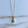 Teardrop shaped opal gem on gold chain