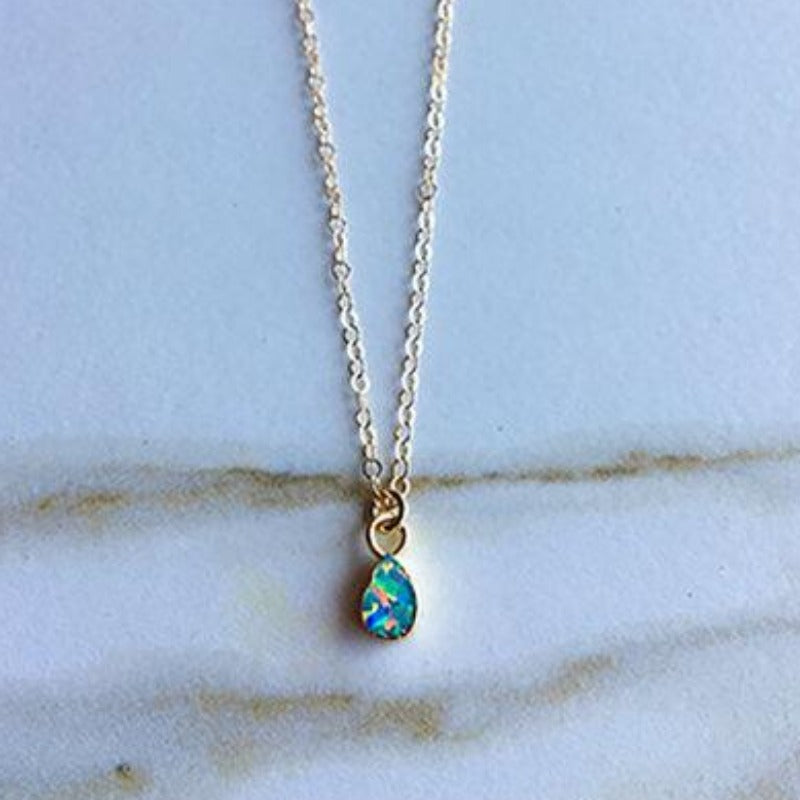 Teardrop shaped opal gem on gold chain