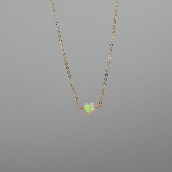 Light pink heart necklace on gold chain