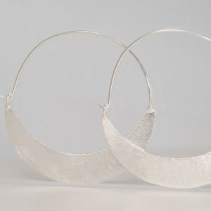 Silver crescent shaped hoop earrings