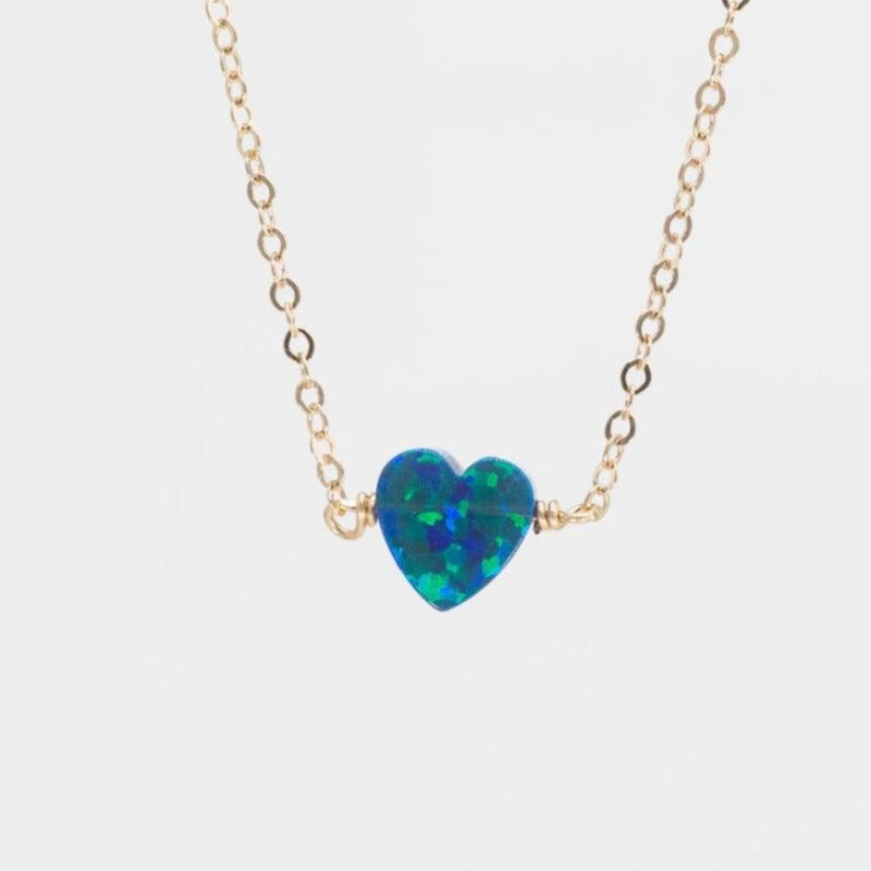 Small blue opal heart on gold necklace