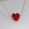 Red heart opal necklace on thin gold chain