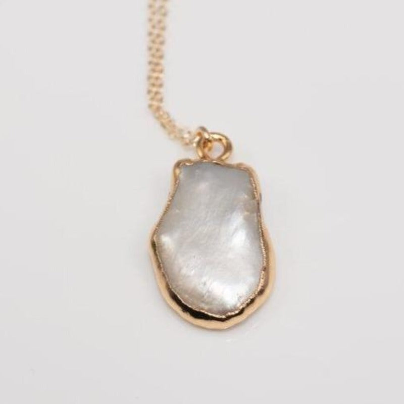 Natural cut white pearl pendant on delicate gold chain