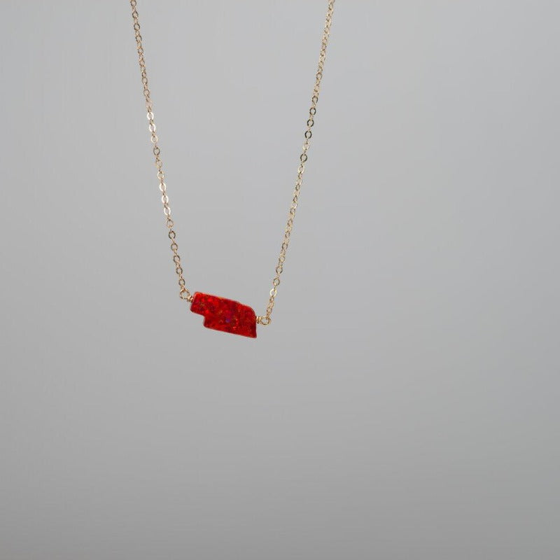 Dainty gold necklace with Red Nebraska state charm in opal