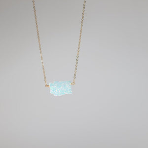 White opal Washington pendant on gold chain