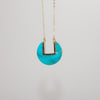 Turquoise coin-shaped pendant on dainty gold chain