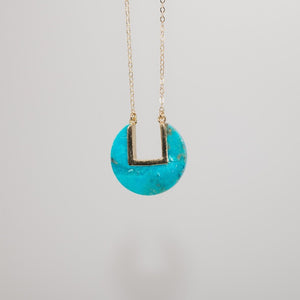 Turquoise coin-shaped pendant on dainty gold chain