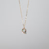 Small dainty abalone "Q" pendant on thin gold chain