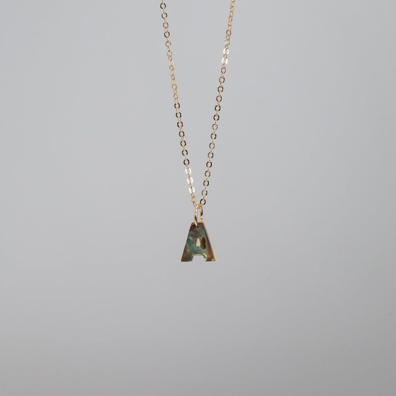 Abalone "A" charm on a gold chain