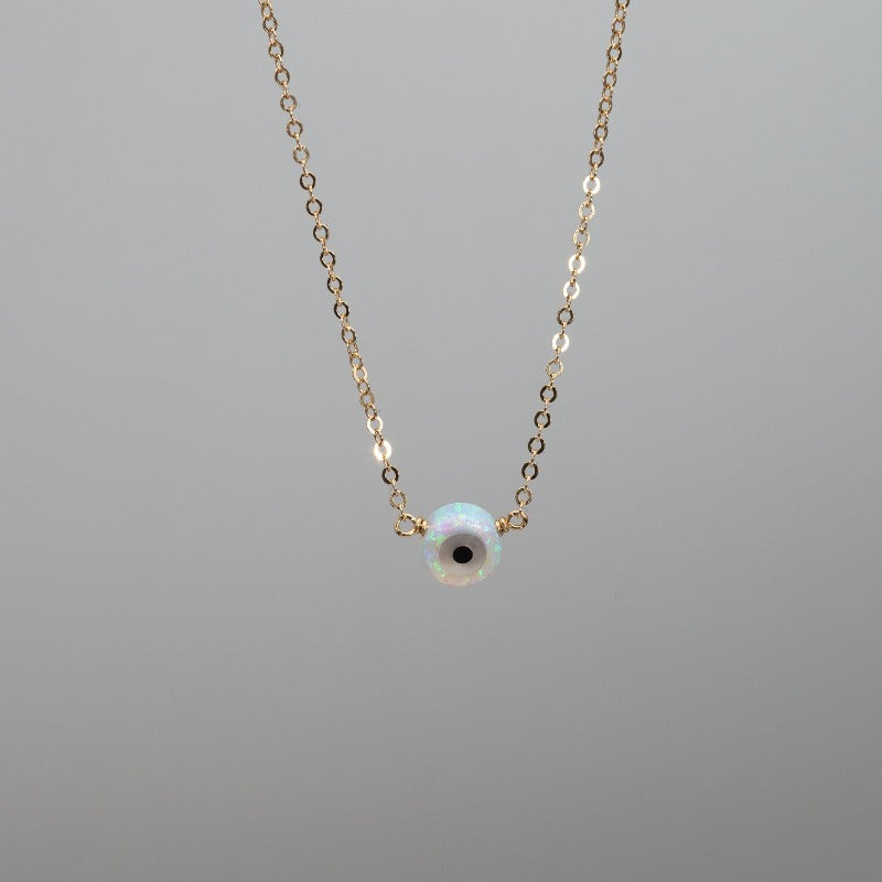 Small white opal evil eye necklace pendant