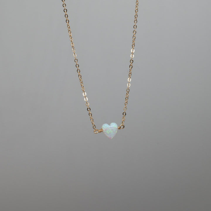 Tiny white heart necklace in opal and gold