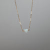 Tiny white heart necklace in opal and gold