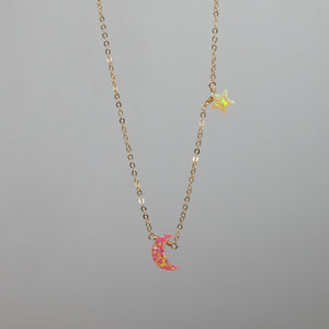 Pink crescent moon charm necklace with yellow star in opal and gold