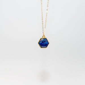 Delicate gold chain with small blue lapis hexagon pendant