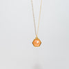Orange Sunstone hexagon pendant in gold
