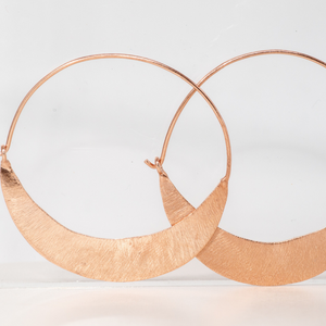 Stunning rose gold hoops that thicken to a crescent shaped moon
