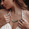 model wearing abalone handcrafted rings and necklace