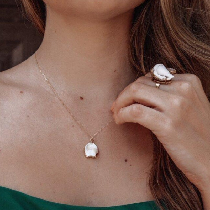 Natural cut white pearl pendant on delicate gold chain